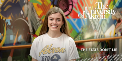 University of Akron student with long blonde hair smiling into camera.